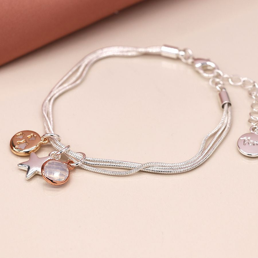 Silver plated triple strand mixed star and crystal charm bracelet