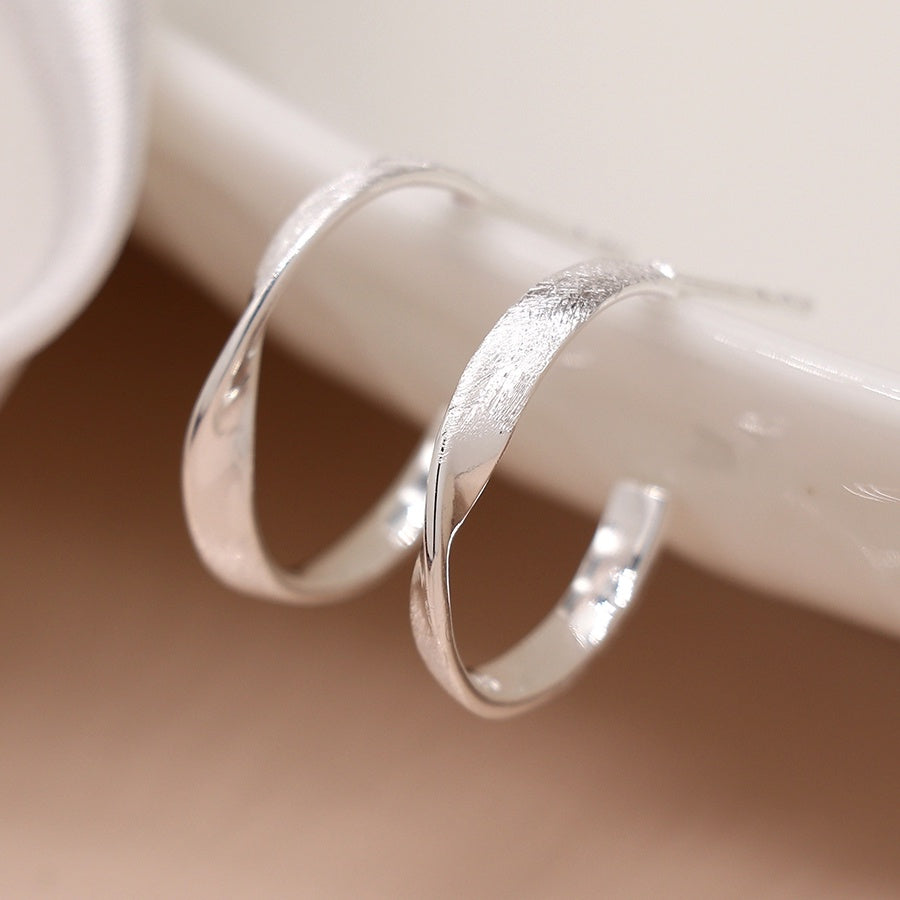 Sterling silver mixed finish twist hoop earrings